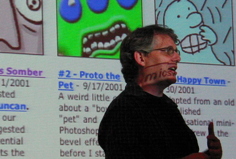 Photo of Scott McCloud in front of a projected computer image